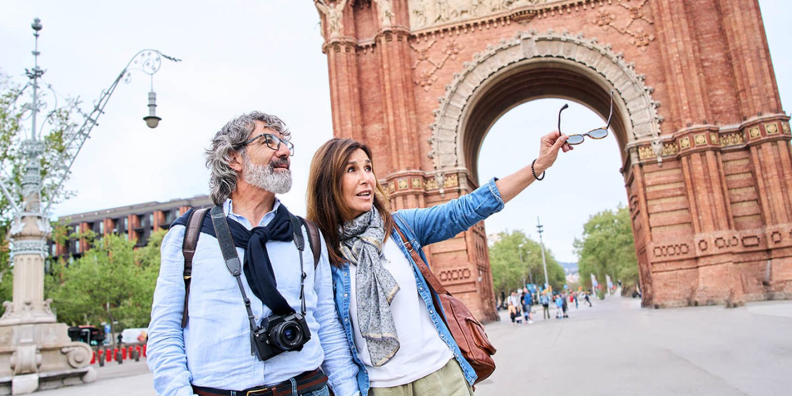 coule standing in front of arch