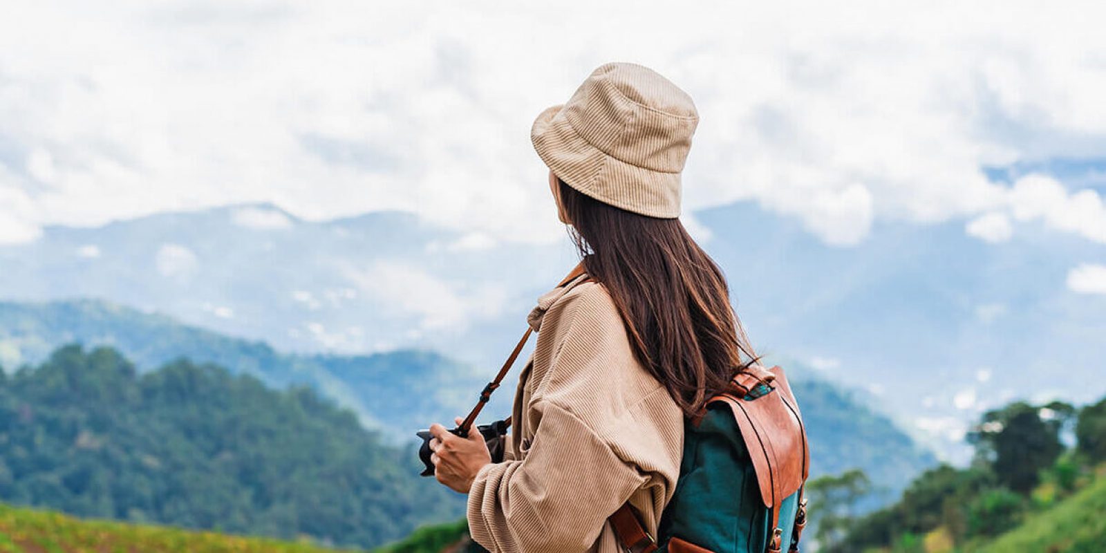 young-woman-traveler-taking-a-beautiful-landscape